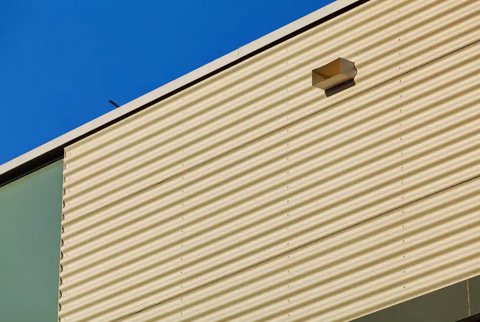 Aluminum facade and panel installation on industrial building by commercial siding contractor