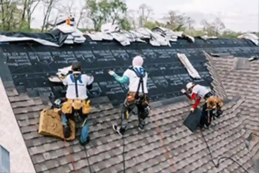 Contractors repairing a roof