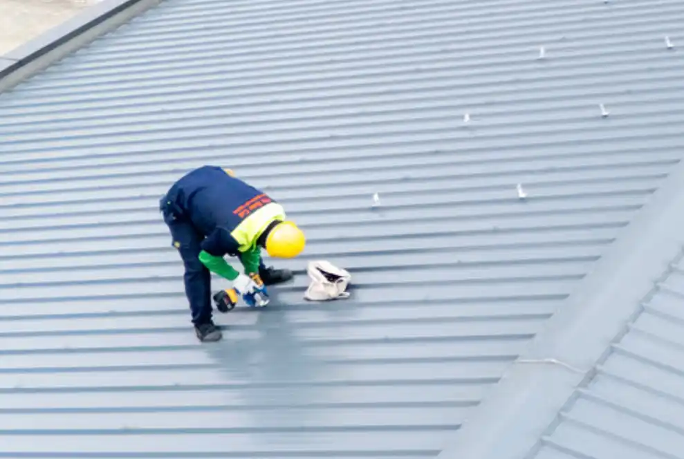 Commercial metal roofing contractor workin on a project in the DMV